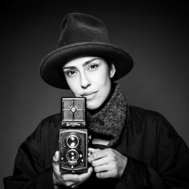 Andi with Rolleiflex in Yammoto Coat and Hat